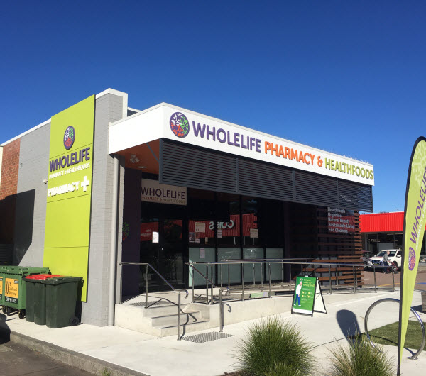 Exterior view of a healthy food shop and pharmacy